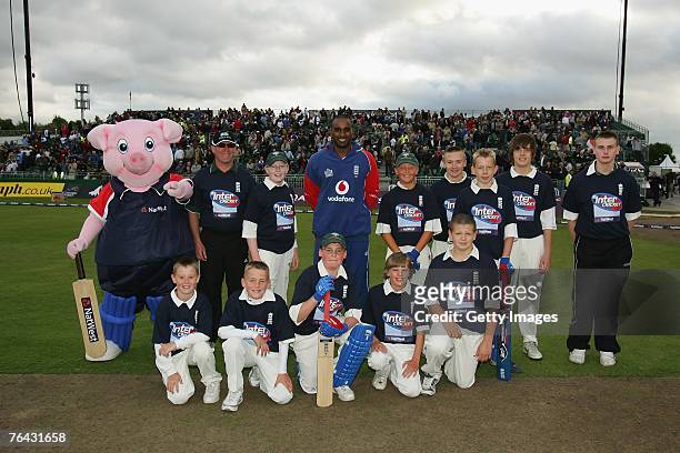 Ramsbottom CC pose with Dimitri Mascarenhas of England during the Fourth NatWest Series One Day International Match between England and India at Old...