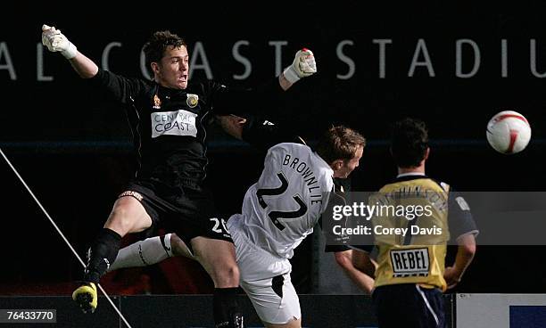 Mariners goalkeeper Danny Vukovic and Royce Brownlie of the Phoenix contest the ball during the round two Hyundai A-League match between the Central...