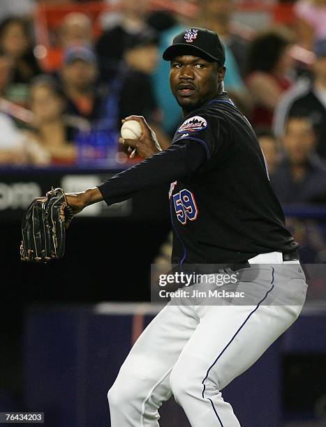 Guillermo Mota of the New York Mets throws to first against the Minnesota Twins during their inter-league game on June 20, 2007 at Shea Stadium in...