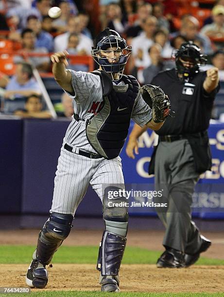 Joe Mauer of the Minnesota Twins throws to first against the New York Mets during their inter-league game on June 20, 2007 at Shea Stadium in the...