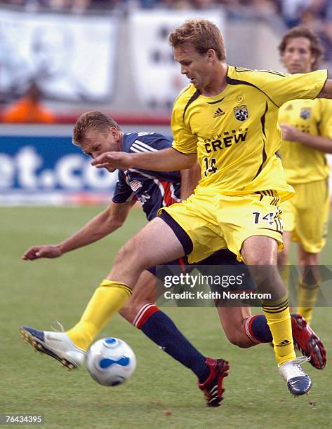 New England Revolution's Adam Cristman collides with Columbus Crew's Chad Marshall during MLS action at Gillette Stadium in Foxborough, Massachusetts...