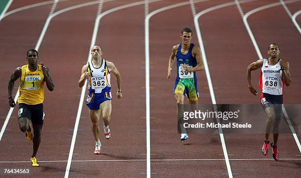 Maurice Smith of Jamaica, Francois Gourmet of Belgium and Carlos Eduardo Chinin of Brazil and Norman Muller of Germany compete in the 400m Round of...