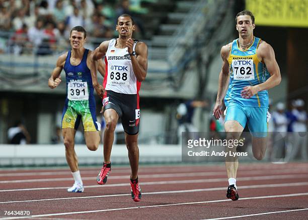 Carlos Eduardo Chinin of Brazil, Norman Muller of Germany and Dmitriy Karpov of Kazakstan compete in the 400m Round of the Men's Decathlon on day...