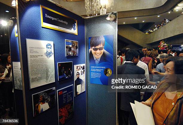 Guests view the display on the 2007 Ramon Magsaysay awardee, blind Chinese human rights activist Chen Guangcheng after ceremonies at the Cultural...
