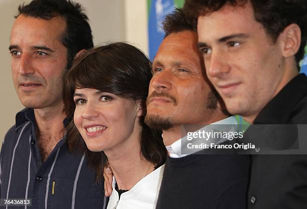 Actors Bruno Todeschini, Irene Jacob, director Paolo Franchi and actor Elio Germano attend the Nessuna Qualita Agli Eroi photocall in Venice during...