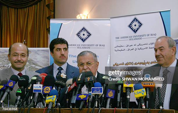 Iraq's President Jalal Talabani gives a press conference flanked by Deputy Prime Minister Barham Saleh , Iraq's autonomous Kurdistan region Prime...