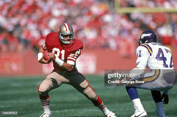 Tight end Russ Francis of the San Francisco 49ers makes a move against Minnesota Vikings safety Joey Browner during a game at Candlestick Park on...