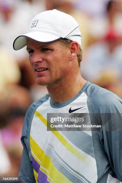 Mark Knowles of the Bahamas looks on as he and Daniel Nestor of Canada take on Yves Allegro of Switzerland and Kristof Vliegen of Belgium during day...