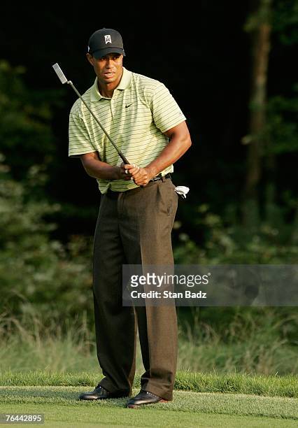 Tiger Woods watches his putt on 18th during the first round of the Deutsche Bank Championship at TPC Boston on August 31, 2007 in Norton,...