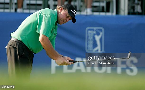 Phil Mickelson reacts to his putt at the 15th green during the first round of the Deutsche Bank Championship at TPC Boston on August 31, 2007 in...