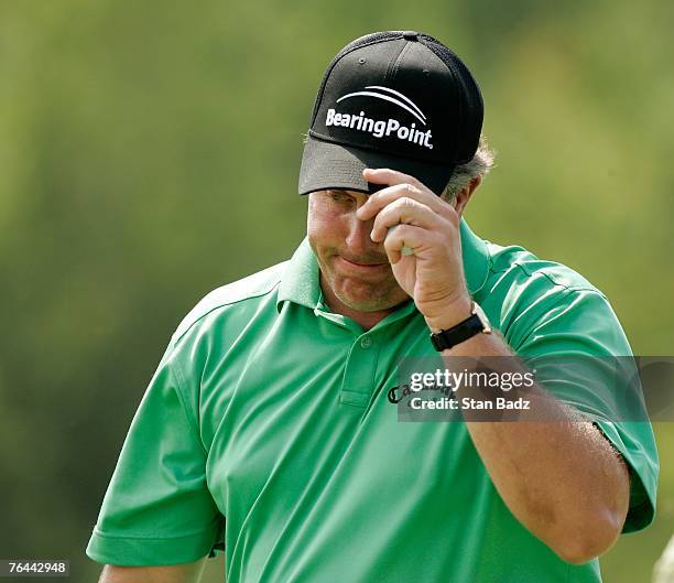 Phil Mickelson reacts to his putt at the second green during the first round of the Deutsche Bank Championship at TPC Boston on August 31, 2007 in...