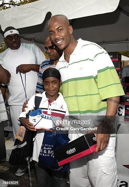 Pro Basketball Player Stephon Marbury with Jahsiyh, giving away his Starbury Sneakers at The New York Call and Youth Xplosion - Starbury Giveback Day...