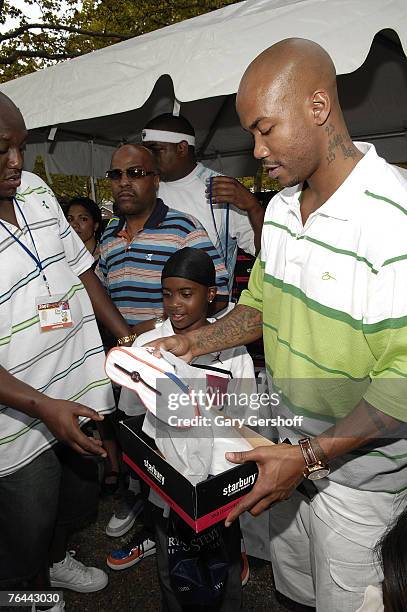 Pro Basketball Player Stephon Marbury with Jahsiyh, giving away his Starbury Sneakers at The New York Call and Youth Xplosion - Starbury Giveback Day...