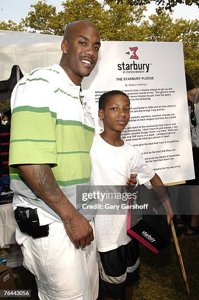 Pro Basketball Player Stephon Marbury with Roger Mull giving away his Starbury Sneakers at The New York Call and Youth Xplosion - Starbury Giveback...