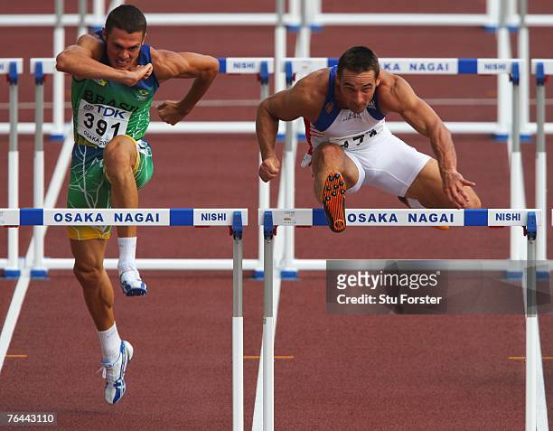 Carlos Eduardo Chinin of Brazil and Roman Sebrle of the Czech Republic compete in the 110m Hurdles Round during the Men's Decathlone on day eight of...
