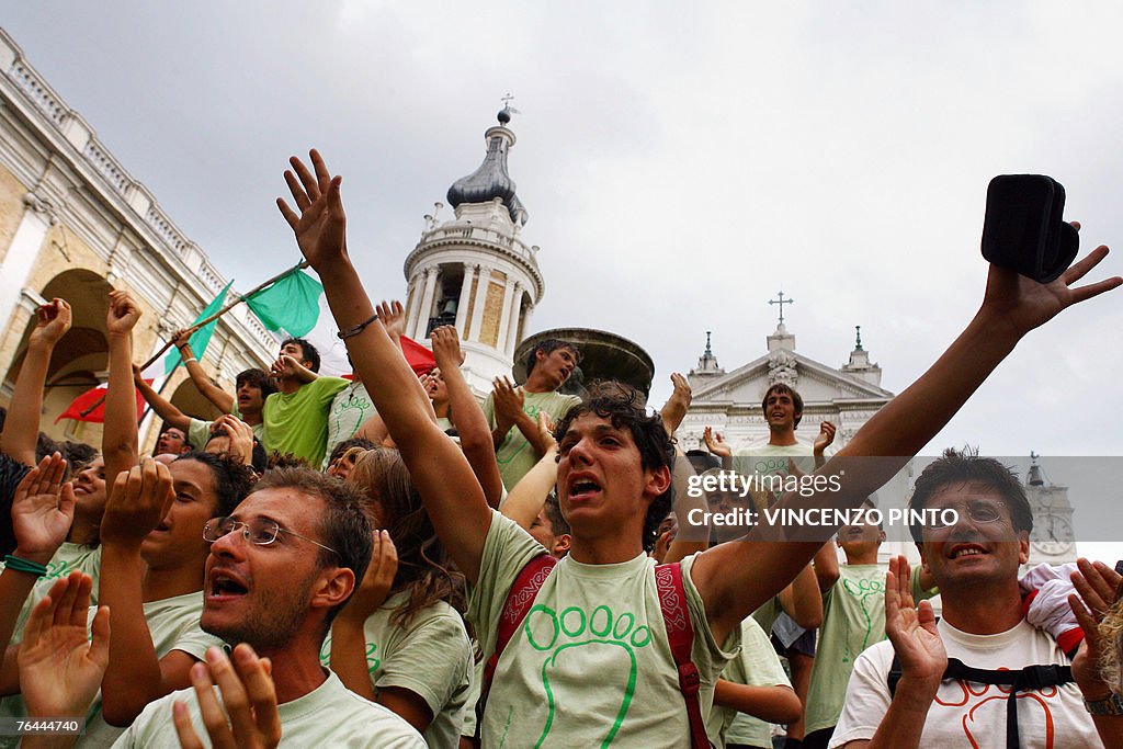 People cheer as they arrive on the squar