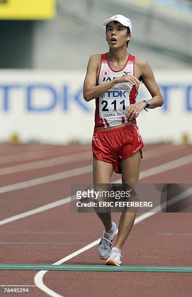 Japan's Yuki Yamazaki crosses the finish line during the men's 50kms walk, 01 September 2007, at the 11th IAAF World Athletics Championships, in...