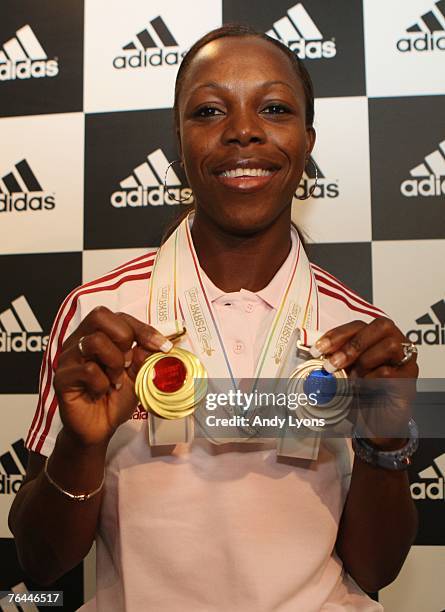 Veronica Campbell of Jamaica appears at a photocall at the Adidas Performance Centre during day eight of the 11th IAAF World Athletics Championships...