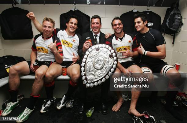 Steven Yates, Mikaele Tu'u, Coach Rob Penney, Johnny Leo'o and Isaac Ross of Canterbury celebrate with the Ranfurly Shield in the changing rooms...