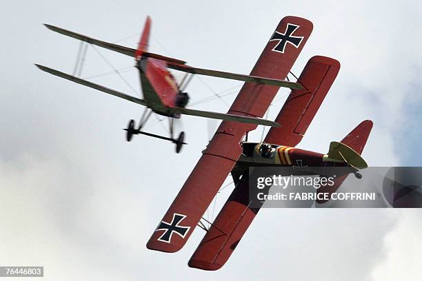 Royal Aircraft Factory SE-5A faces a Boeing PT-17 Stearman painted in German WWI colours 01 Sept 2007 in Bex. The vintage aircraft perform a dogfight...
