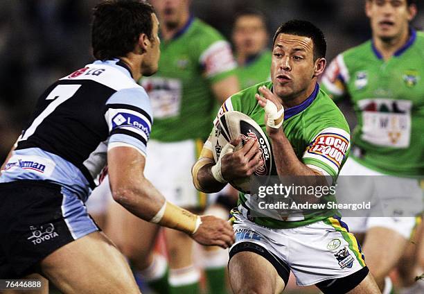 Lincoln Withers of the Canberra Raiders is tackled during the round 25 NRL match between the Canberra Raiders and the Cronulla-Sutherland Sharks at...