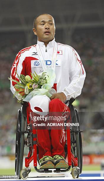 Japan's silver medalist Soejima Masazumi poses on the podim of the men's 1500m wheelchair final, 01 September 2007, at the 11th IAAF World Athletics...