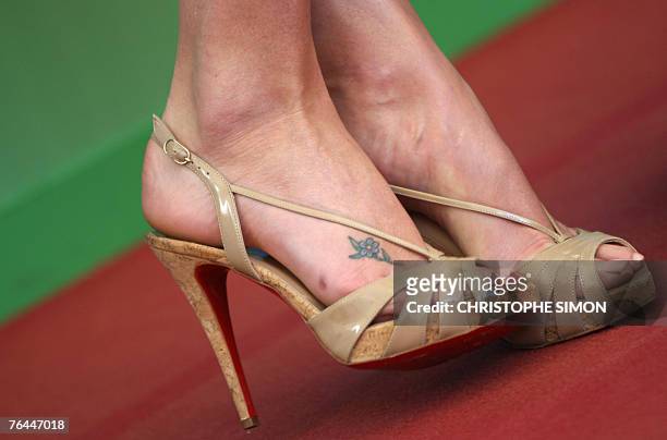View of the tatoo on the right foot of South African actress Charlize Theron during a photocall for the movie in competition for the Golden Lion "In...