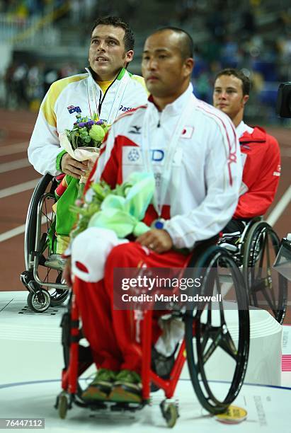 Gold medalist Kurt Fearnley of Australia, silver medalist Soejima Masazumi and bronze medalist Marcel Hug of Switzerland receive their medals for the...