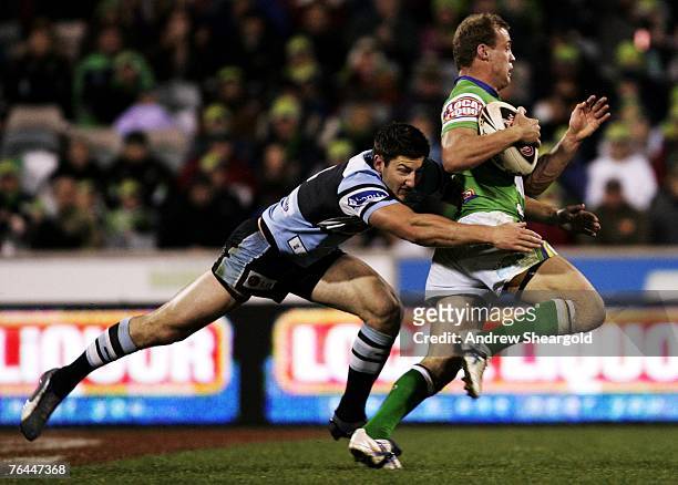 Brett Kelly of the Canberra Raiders makes a break during the round 25 NRL match between the Canberra Raiders and the Cronulla-Sutherland Sharks at...