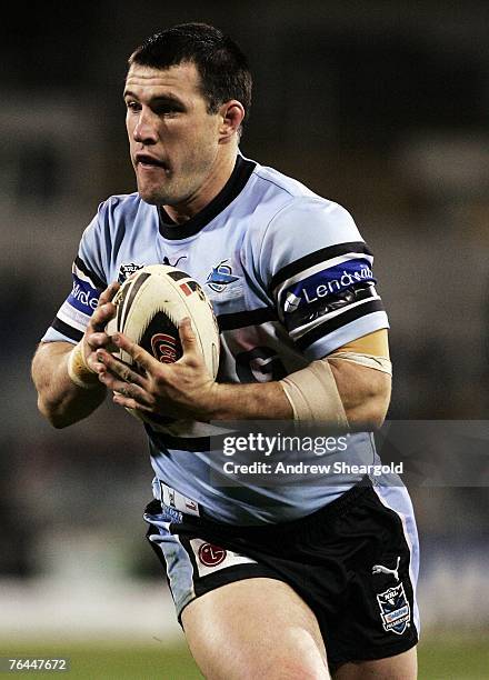 Paul Gallen of the Cronulla Sharks runs with the ball during the round 25 NRL match between the Canberra Raiders and the Cronulla-Sutherland Sharks...