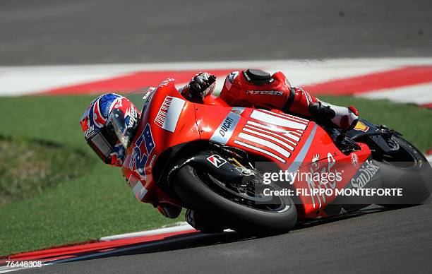 Australian Casey Stoner leans his Ducati into a corner during the MotoGP qualifing session at Misano circuit for the San Marino Grand Prix in Misano...