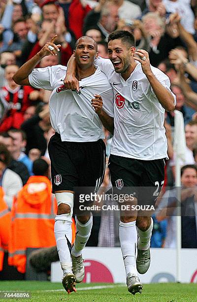 Fulham's Dimansy kamara celebrates his equalising goal with teammate Clint Dempsey during their Premiership match against Tottenham at home to Fulham...