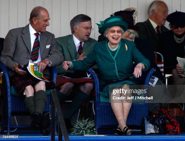 Queen Elizabeth II and Prince Philip, Duke of Edinburgh, attend the Braemar Gathering at the Princess Royal and Duke of Fife Memorial Park on...