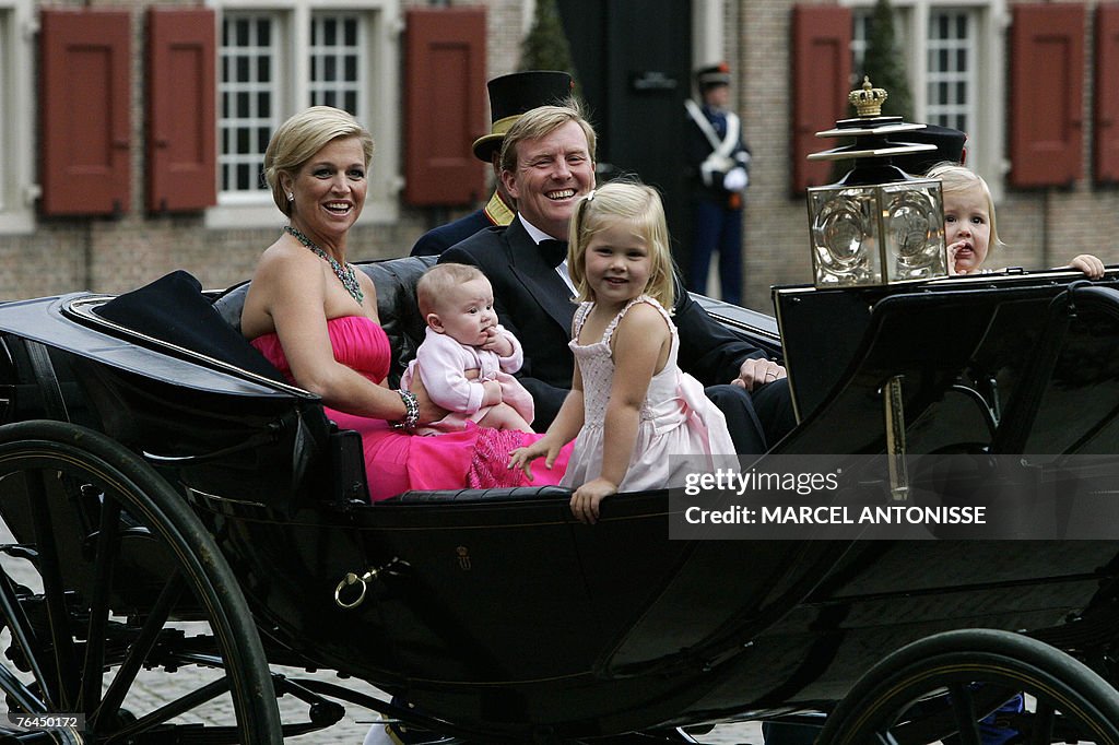 Prince Willem-Alexander (C) sits with hi