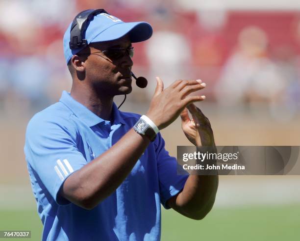 Head coach Karl Dorrell of the UCLA Bruins signals a timeout during the UCLA 45-17 defetat of the Stanford Cardinal at Stanford Stadium September 1,...