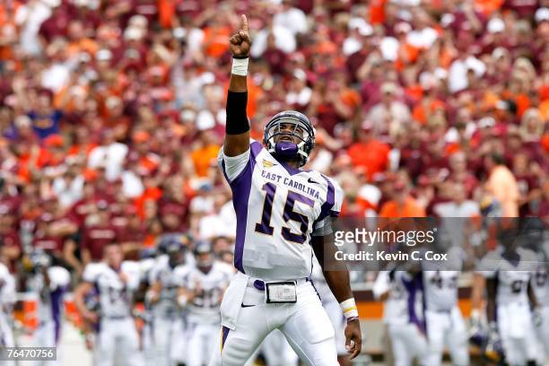Quarterback Patrick Pinkney of the East Carolina Pirates reacts after the Pirates scored a touchdown against the Virginia Tech Hokies on September 1,...
