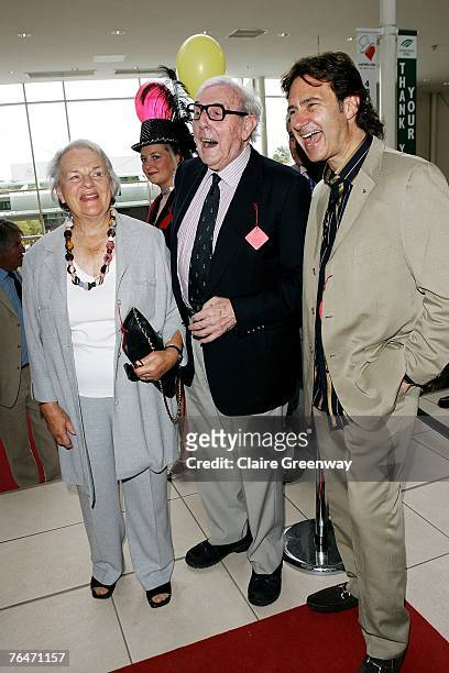Actor Eric Sykes , his wife Edith and Chief Barker of the Variety Club Russ Kane attend the 49th Variety Club Race Day at Sandown race course on...