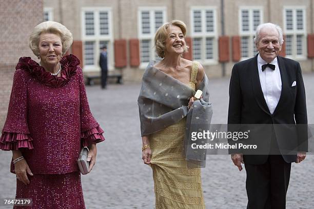 Dutch Queen Beatrix poses with the parents of Princess Maxima, Maria Carmen Cerruti and Jorge de Zorreguieta, as they arrive to attend celebrations...