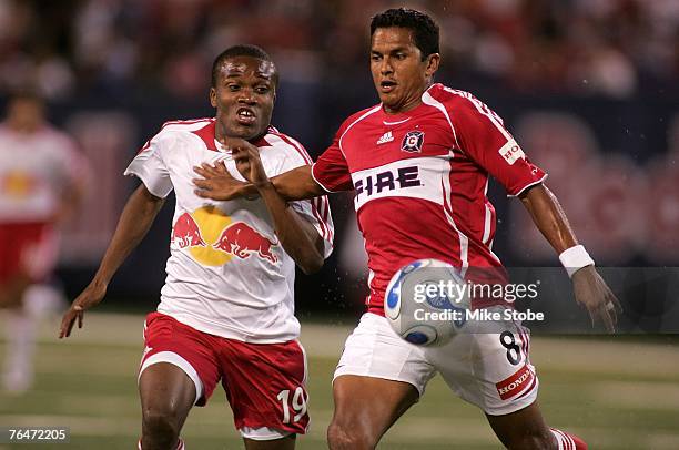 Diego Gutierrez of the Chicago Fire and Dane Richards of the New York Red Bulls fight for control of the ball at Giants Stadium in the Meadowlands on...