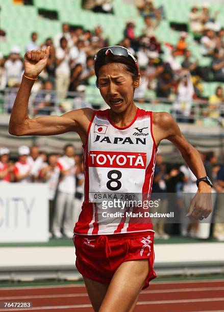 Reiko Tosa of Japan celebrates finishing in third place in the Women's Marathon on day nine of the 11th IAAF World Athletics Championships on...