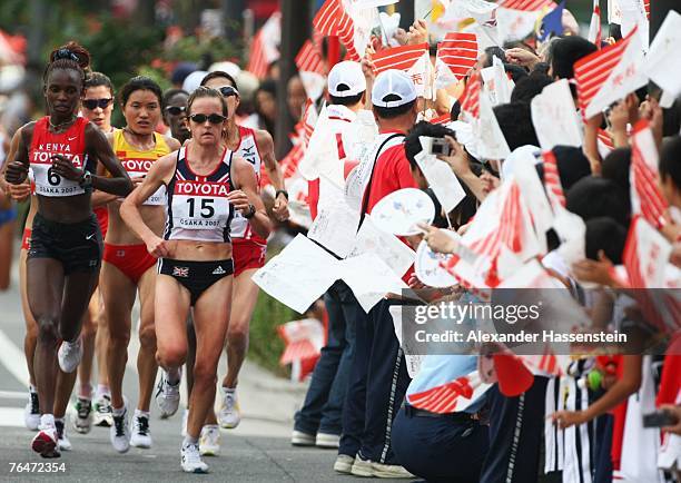 Rita Jeptoo Sitienei of Kenya and Mara Yamauchi of Great Britain compete during the Women's Marathon on day nine of the 11th IAAF World Athletics...