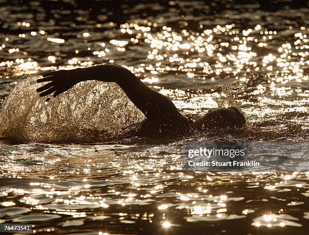 Competitor swims during of an age group race at the Triathlon World Championships on September 2, 2007 in Hamburg, Germany.