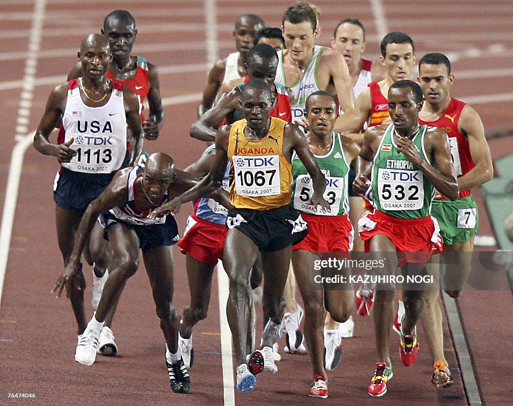 Britian's Mohammed Farah (2ndL) trips in