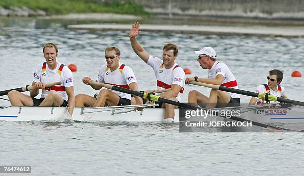 Germany's cox Martin Sauer, Florian Mennigen, Stephan Koltzk, Philipp Naruhn, Matthias Flach celebrate their third place in the men's coxed four...