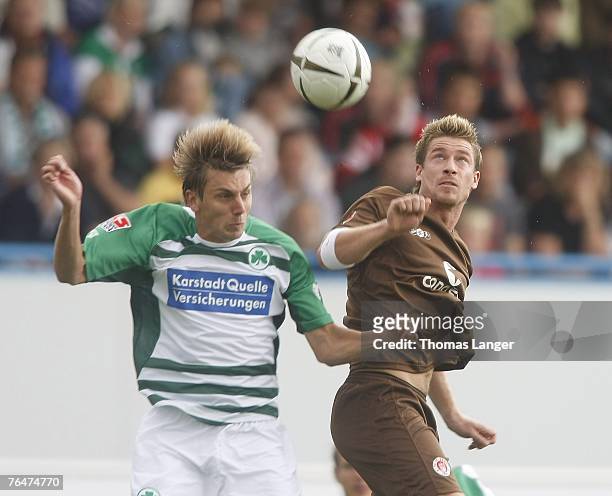 Marvin Braun of St Pauli and Timo Achenach of Fuerth battle for the ball during the 2. Bundesliga match between SpVgg Greuther Fuerth and FC St....