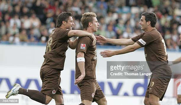 Alexander Ludwig; Marvin Braun and Thomas Meggle of St Pauli celebrate after Brauns first goal during the 2. Bundesliga match between SpVgg Greuther...