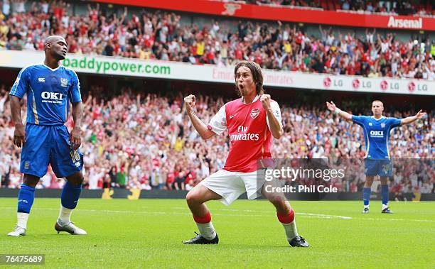 Tomas Rosicky of Arsenal celebrates Arsenal's third goal during the Barclays Premier League match between Arsenal and Portsmouth at the Emirates...