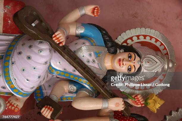 saraswati murthi (statue) in goverdan. india. - saraswati stock-fotos und bilder