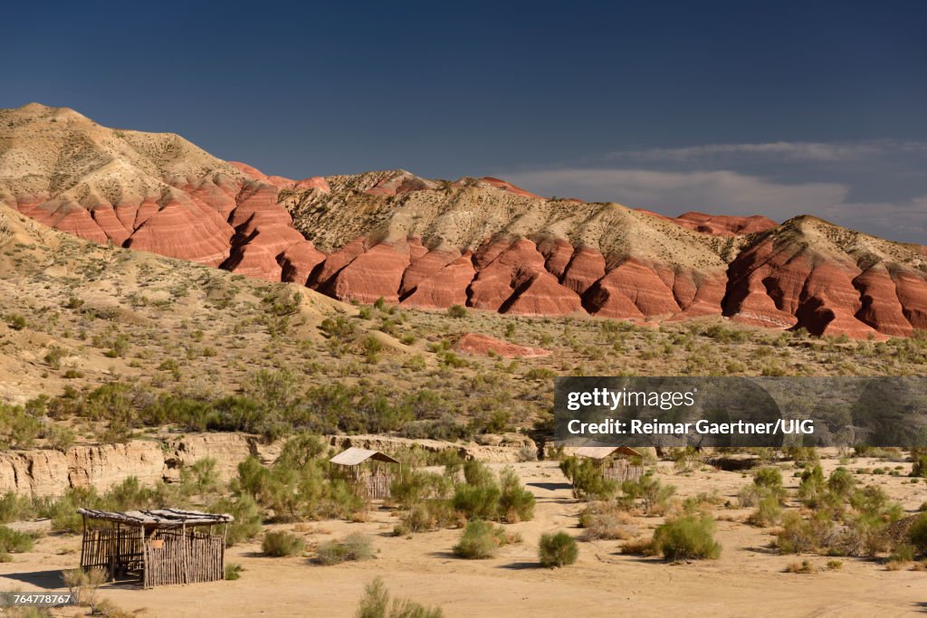 Picnic area at red and white eroded Aktau mountains in Altyn Emel National Park Kazakhstan