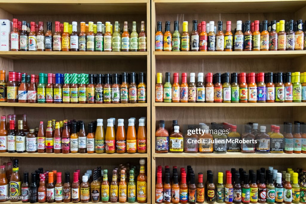 Jars of sauce on shelves in store